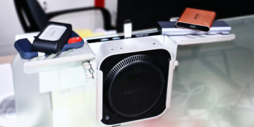 This Mac mini “exoskeleton” flips the script by hiding your computer behind the desk instead of showing it off